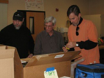 Couple Mentors around a Box